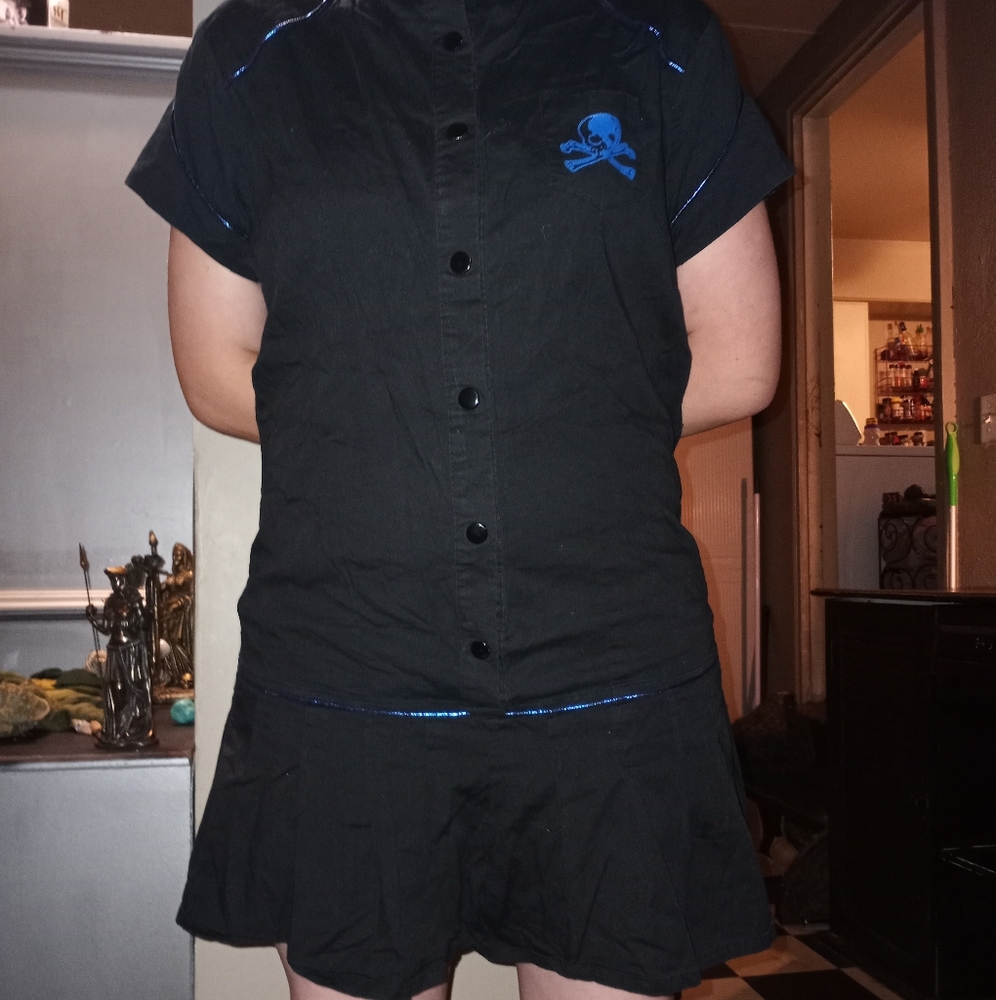 Black dress with blue piping and blue skull